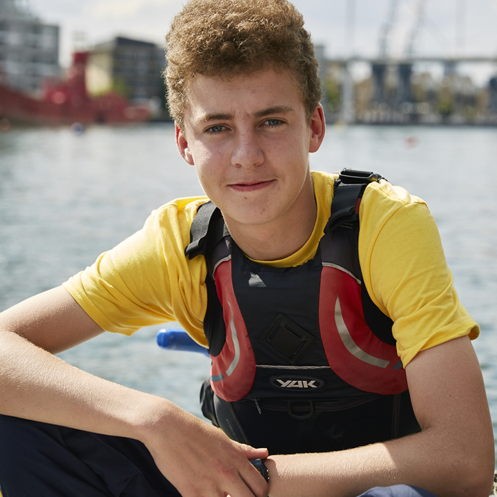 Boy Sea Cadet sitting onboard a ship