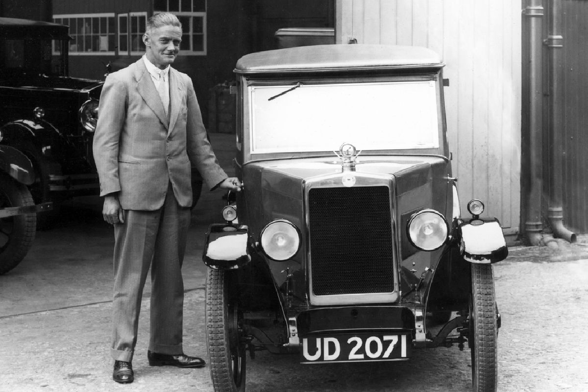 Lord Nuffield standing next to a Morris motor